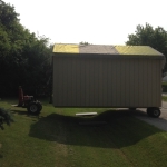 Moving a shed through the ditch with our steel ramps